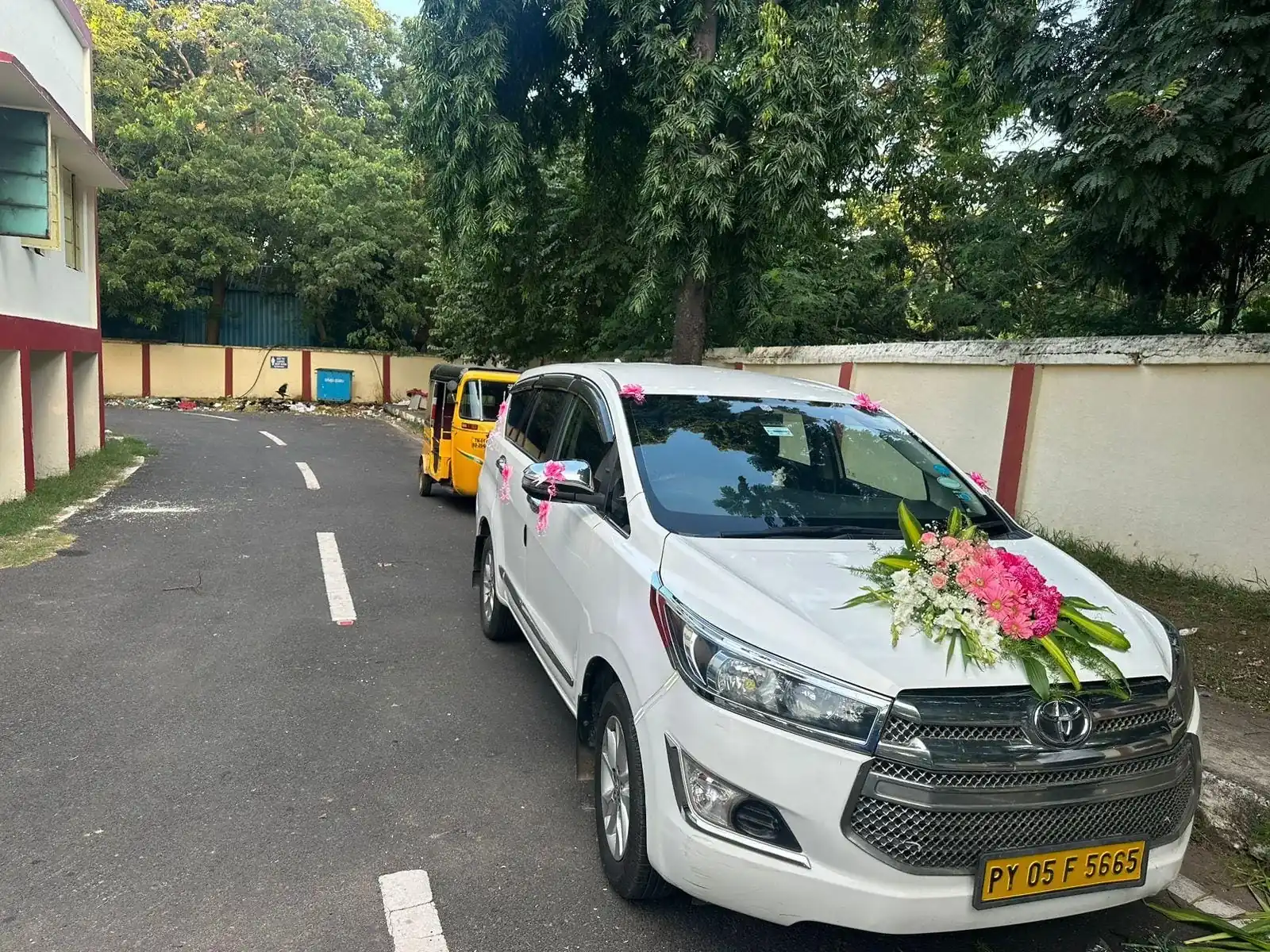 Innova Crysta decorated with flowers as a wedding car in Chennai