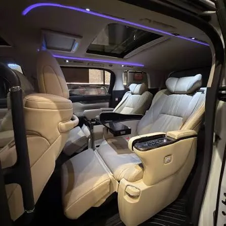 Toyota Vellfire cabin with ambient lighting and cream leather captain seats