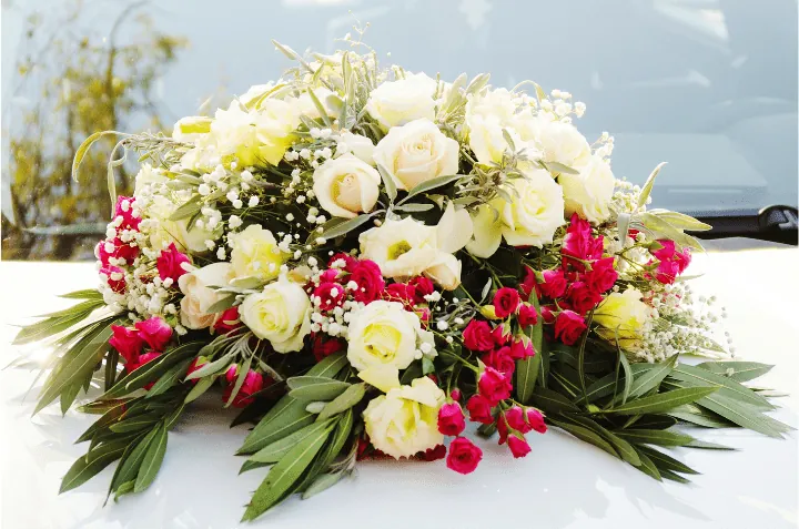 Fresh flower bouquet decoration on the bonnet of a wedding car